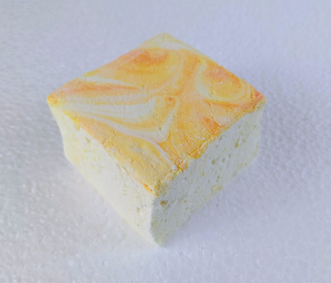 A single Gourmet Handcrafted Lemon Pound Cake Marshmallows – Artisan Treats for Hot Chocolate & S'mores, Made with Beef Gelatin on white background