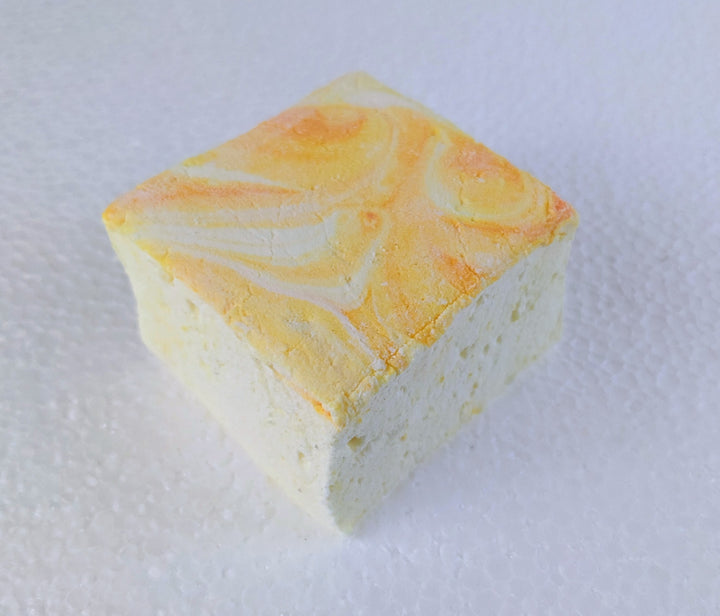 A single Gourmet Handcrafted Lemon Pound Cake Marshmallows – Artisan Treats for Hot Chocolate & S'mores, Made with Beef Gelatin on white background