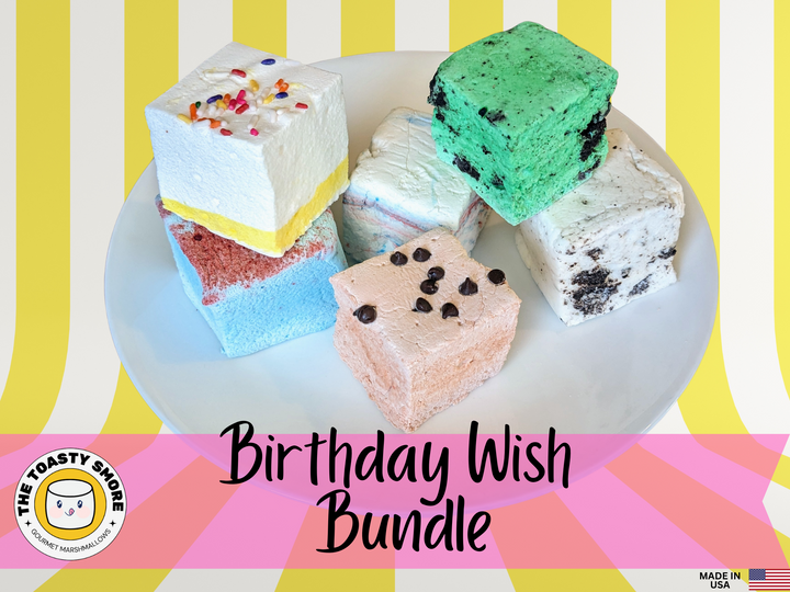 A white plate featuring a vibrant assortment of birthday-themed marshmallows in flavors: birthday cake, cotton candy, blue raspberry, cookie dough, cookies & cream, and mint oreo.