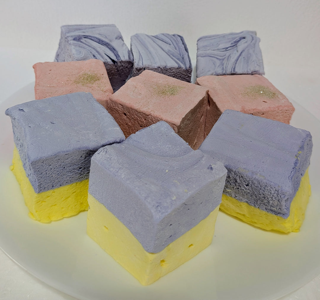 Colorful lBougie Marshmallow Bundle on a white plate champagne and sugar lavender and honey and creamy taro