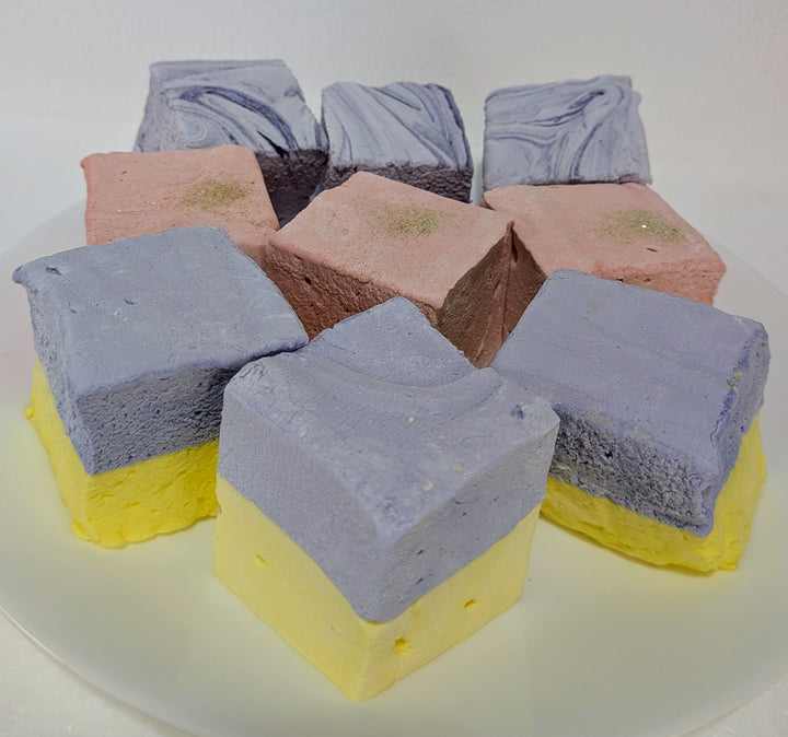 Colorful lBougie Marshmallow Bundle on a white plate champagne and sugar lavender and honey and creamy taro