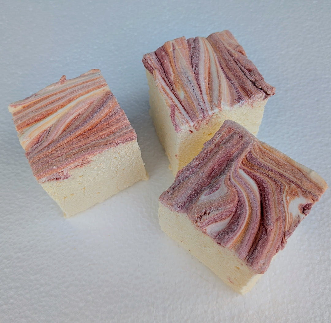 Clean‑label marshmallows in a soft yellow base topped with red and orange fall accents, handcrafted with organic marshmallow root, natural colors, and gluten‑free ingredients.