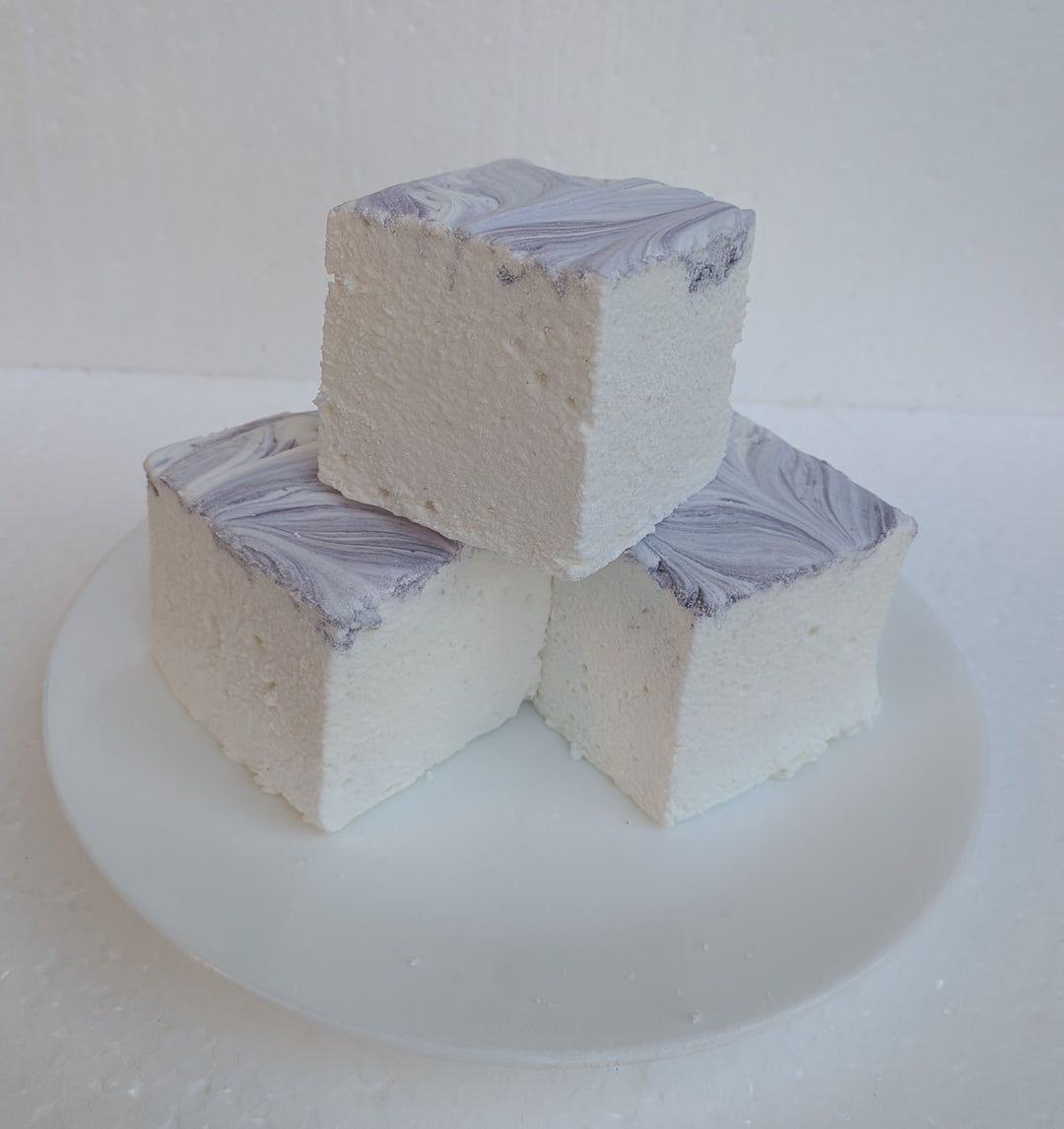 Three Creamy Taro marshmallows with white bases and purple swirled tops, photographed on a bright white background, made in the USA with Halal‑certified beef gelatin, organic marshmallow root, natural dyes, no corn syrup, and gluten‑free ingredients from The Toasty S’more.