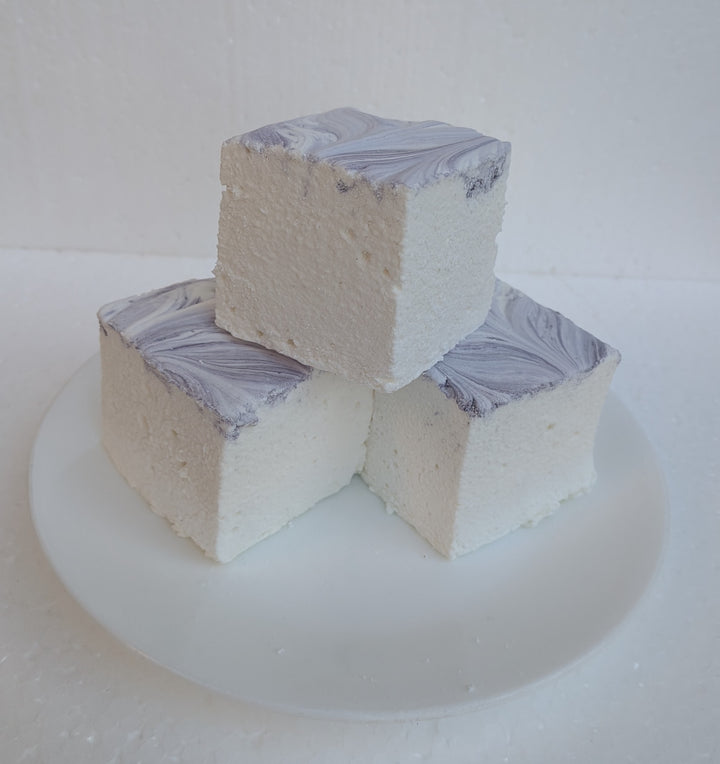 Three Creamy Taro marshmallows with white bases and purple swirled tops, photographed on a bright white background, made in the USA with Halal‑certified beef gelatin, organic marshmallow root, natural dyes, no corn syrup, and gluten‑free ingredients from The Toasty S’more.