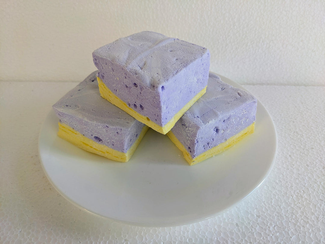 Handcrafted Gourmet Lavender & Honey Marshmallows

A plate of three handcrafted gourmet lavender & honey marshmallows displayed on a clean white background. The image showcases their soft, fluffy texture and delicate floral flavor.