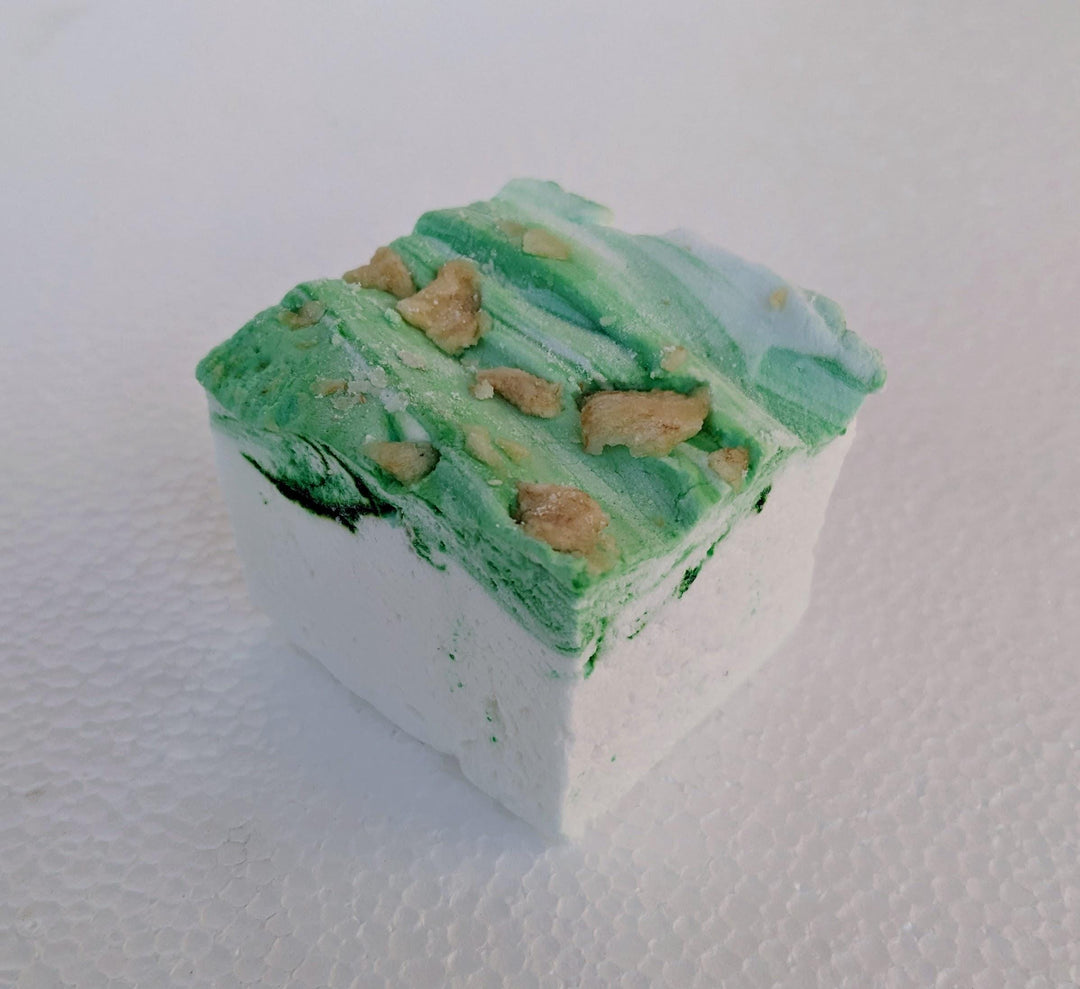 A single handcrafted gourmet pears in wine syrup marshmallow displayed on a clean white background. The marshmallow is approximately 2" x 2" x 1.5", arranged on a clean white plate.