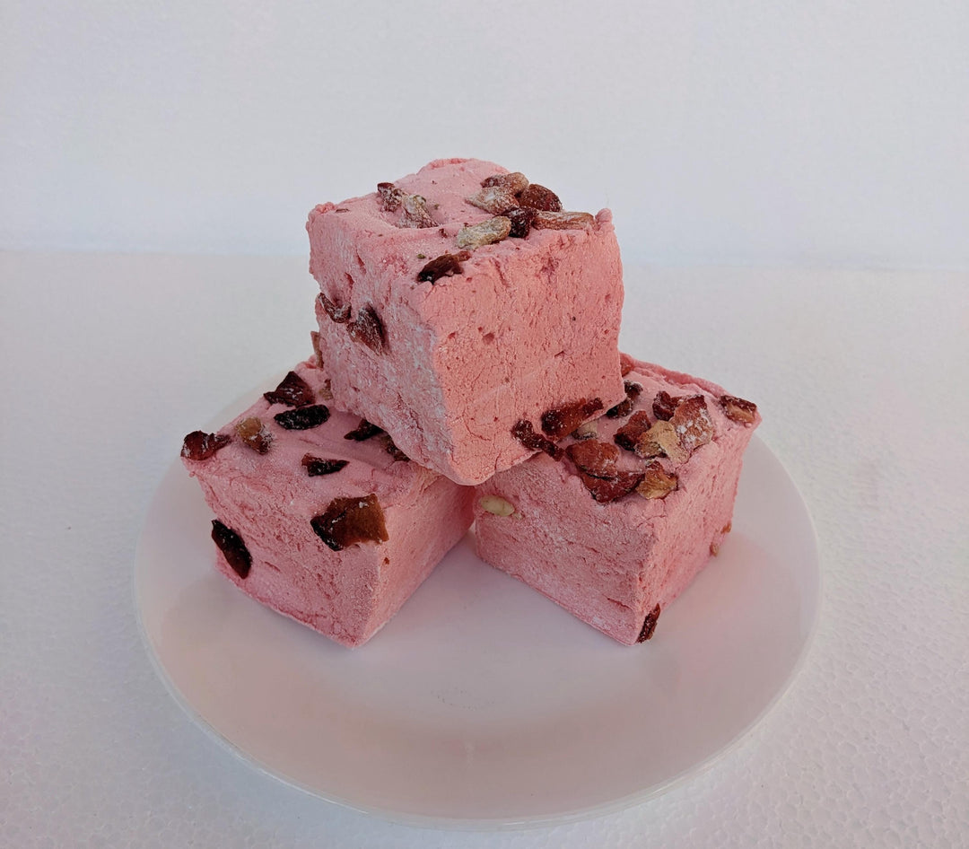 Stack of Three Handcrafted Gourmet Strawberries in White Custard Sauce Marshmallows on a White Background with The Toasty Smore