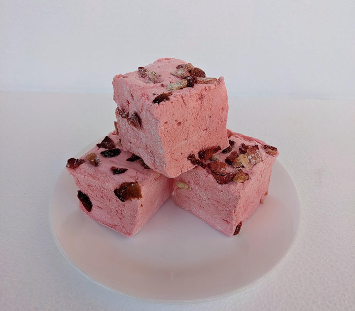 Stack of Three Handcrafted Gourmet Strawberries in White Custard Sauce Marshmallows on a White Background with The Toasty Smore