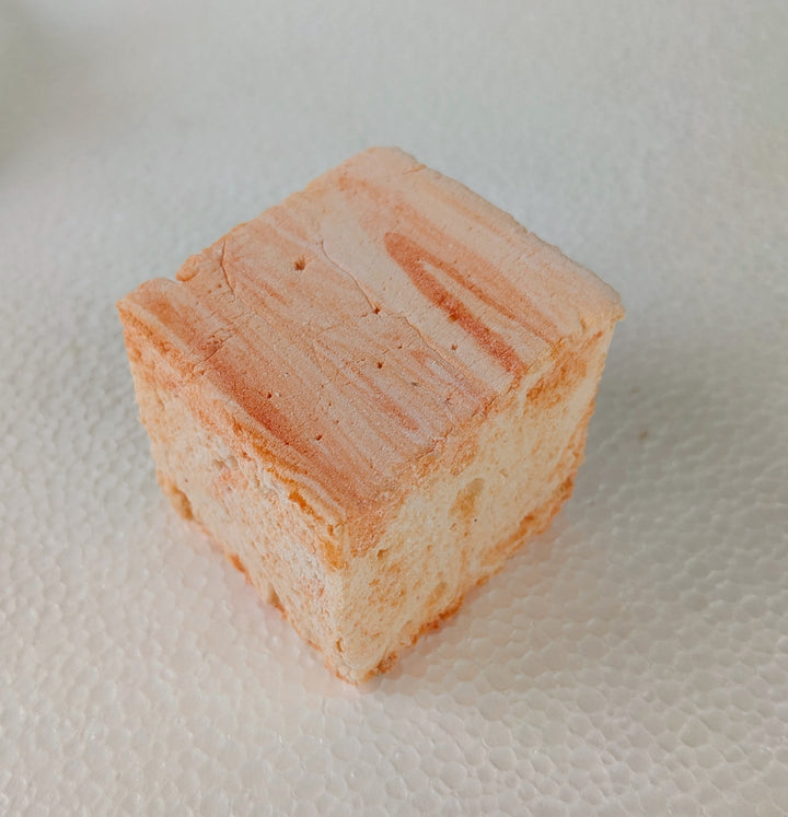 Handcrafted salted caramel gourmet marshmallow with delicate golden caramel swirls, resting on a crisp white surface. Its pillowy texture and rich, buttery flavor create an indulgent artisan confection, perfect for luxury dessert lovers seeking a premium sweet treat made by the toasty smore in the usa