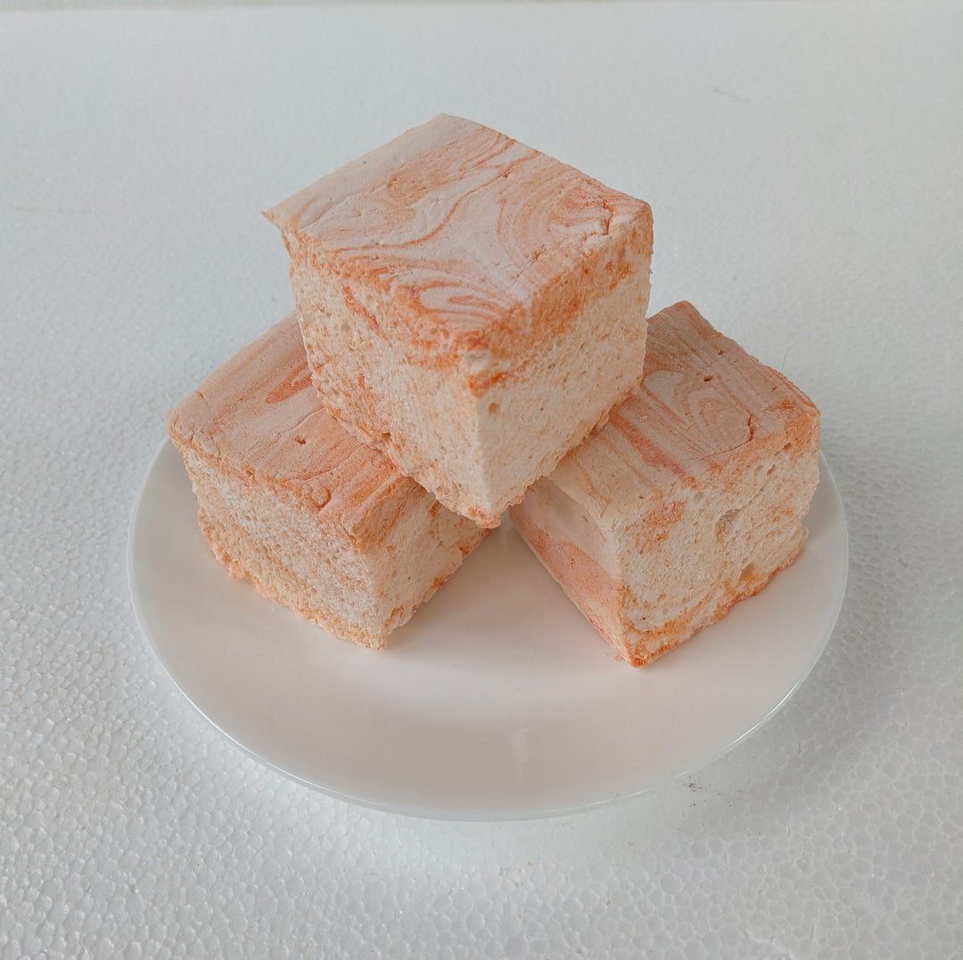 Luxuriously handcrafted salted caramel marshmallow with luscious golden caramel ribbons, elegantly placed on a crisp white plate. This artisanal confection delivers a harmonious blend of rich, buttery sweetness and savory saltiness, perfect for gourmet dessert enthusiasts seeking an indulgent treat. made in USA by the toasty smore