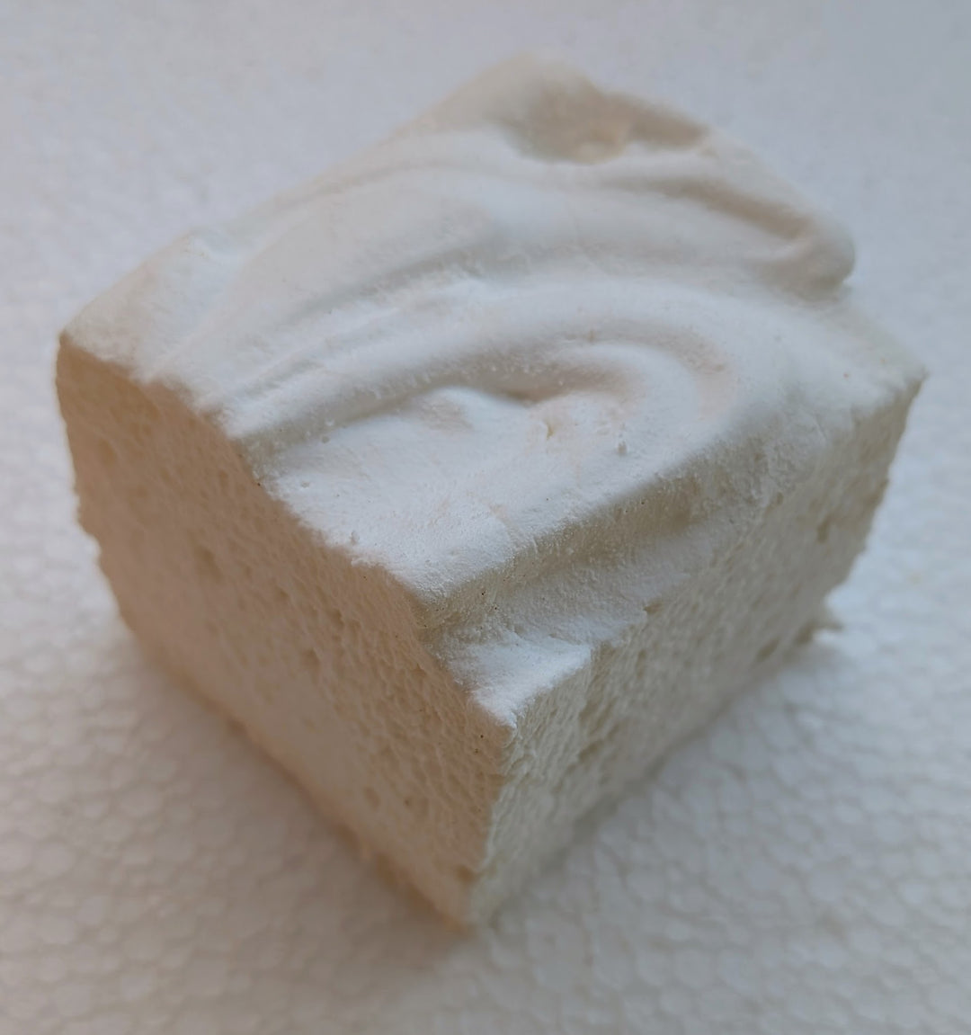 Square marshmallow with white swirl on a white background