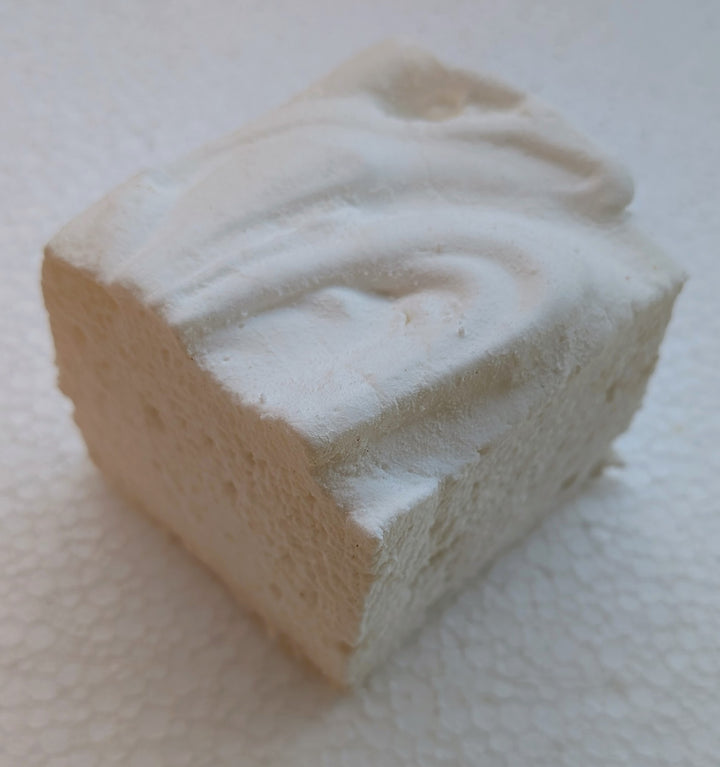 Square marshmallow with white swirl on a white background