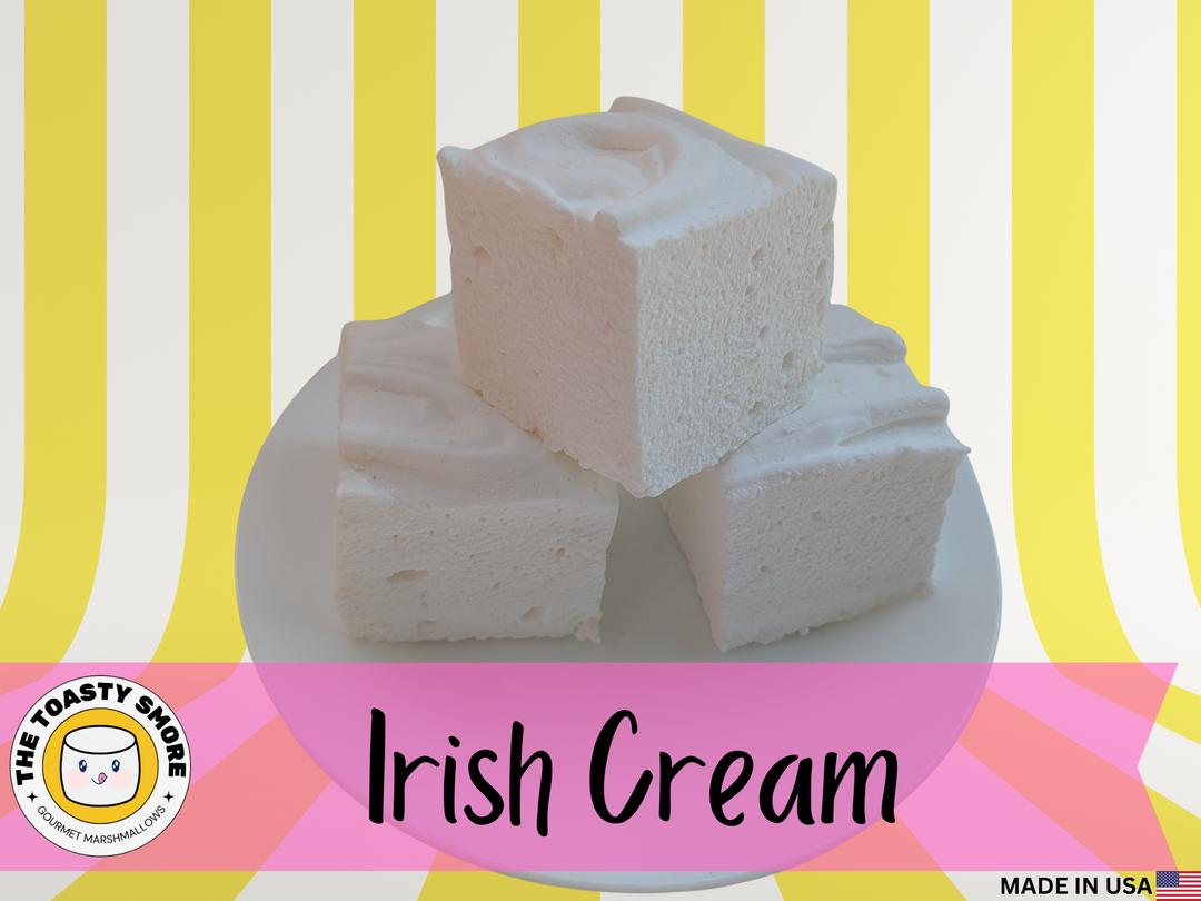 Irish Cream marshmallows on a white plate with a colorful striped background, featuring 'The Toasty Snorer' brand.