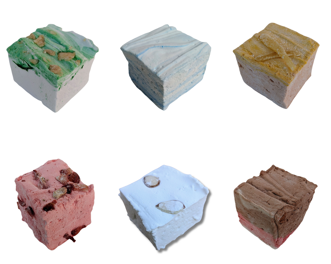 A delightful array of our Medieval Delight Bundle marshmallows elegantly displayed on a two-tiered fancy plate. Featuring flavors like Red Rose Pudding, Gingerbread, Almond Cake, Junket with Blueberries, Pears in Wine Syrup, and Strawberries in White Custard Sauce