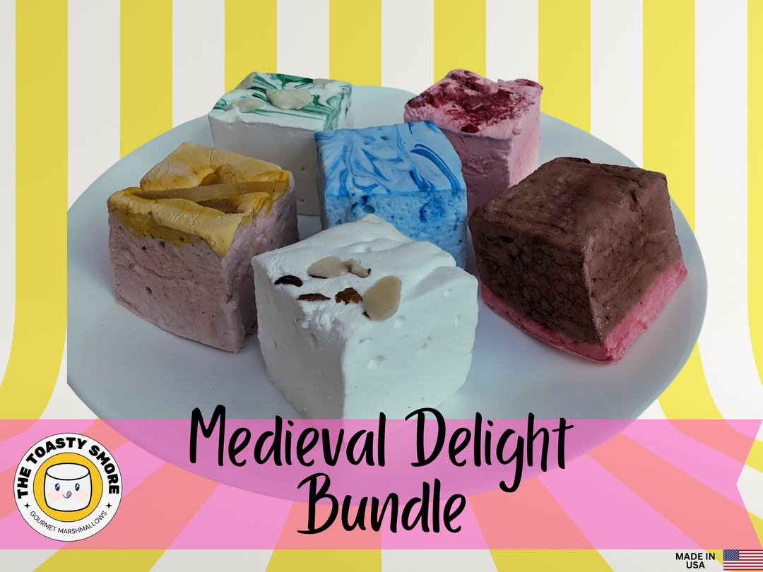 A tempting selection of our Medieval Delight Bundle marshmallows elegantly displayed on a two-tiered fancy plate. Features flavors such as Red Rose Pudding, Gingerbread, Almond Cake, Junket with Blueberries, Pears in Wine Syrup, and Strawberries in White Custard Sauce
