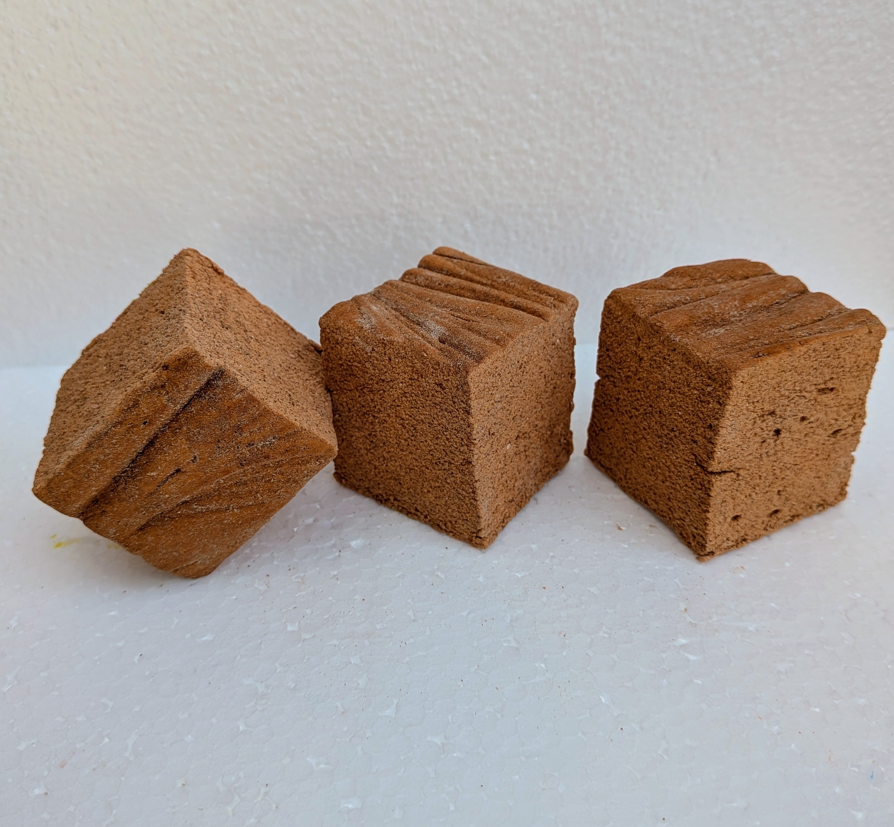 Three pumpkin spice marshmallows made with beef gelatin, organic marshmallow root, and no corn syrup, arranged on a white background. Each handcrafted marshmallow features a cinnamon sugar topping, highlighting its seasonal flavor and soft texture.