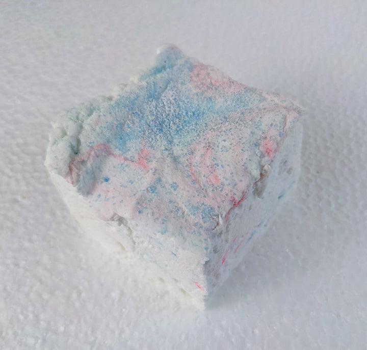 A single cotton candy marshmallow displayed on a clean, white background.