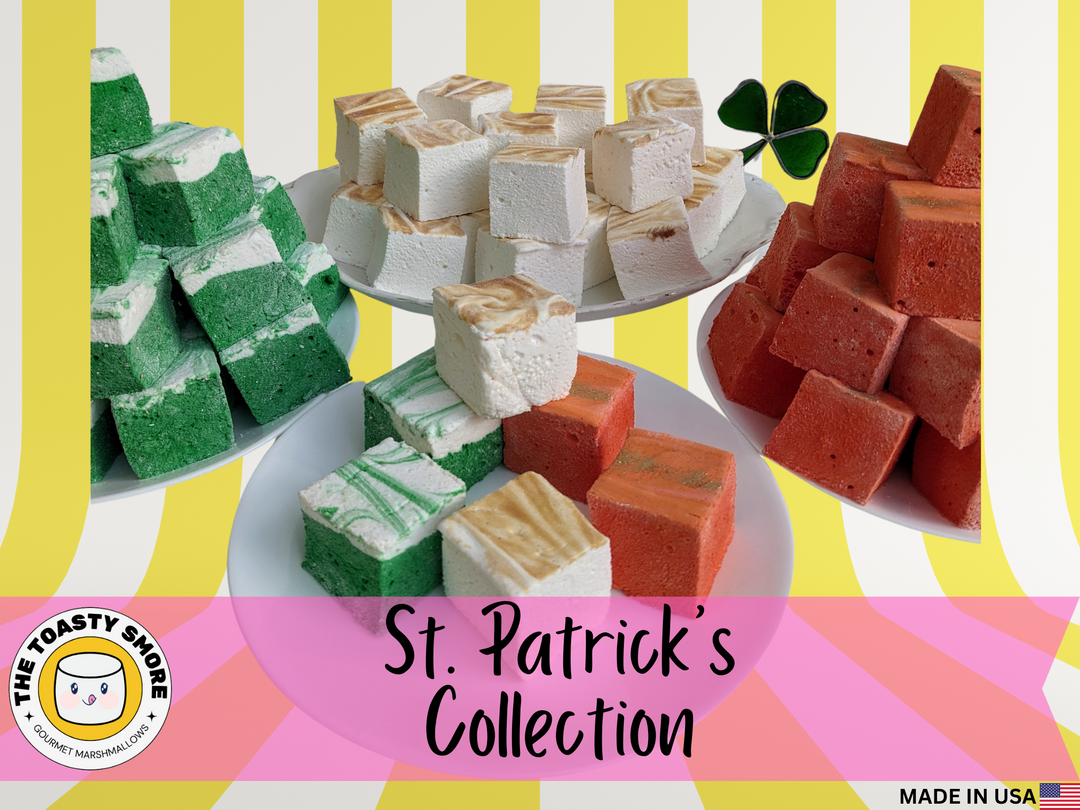 "An assortment of gourmet marshmallows in vibrant shades of green, cream, and gold, beautifully arranged in a gift box adorned with St. Patrick’s Day-themed decorations. The marshmallows are generously sized at 2"x2"x2" and come in three delightful flavors: Irish Cream, Green Ginger Beer, and Golden Butterscotch. Each marshmallow is topped with festive sprinkles and presented against a backdrop of shamrocks and gold coins, capturing the essence of St. Patrick's Day celebrations