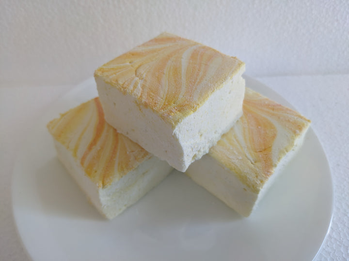 A plate of three Gourmet Handcrafted Lemon Pound Cake Marshmallows – Artisan Treats for Hot Chocolate & S'mores, Made with premium Gelatin by the Toasty Smore