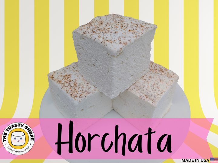 Three creamy horchata marshmallows dusted with cinnamon on top and bottom, naturally color‑free and made with beef gelatin and organic marshmallow root.