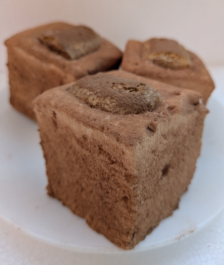 Three Tiramisu Gourmet Marshmallows on a white plate
