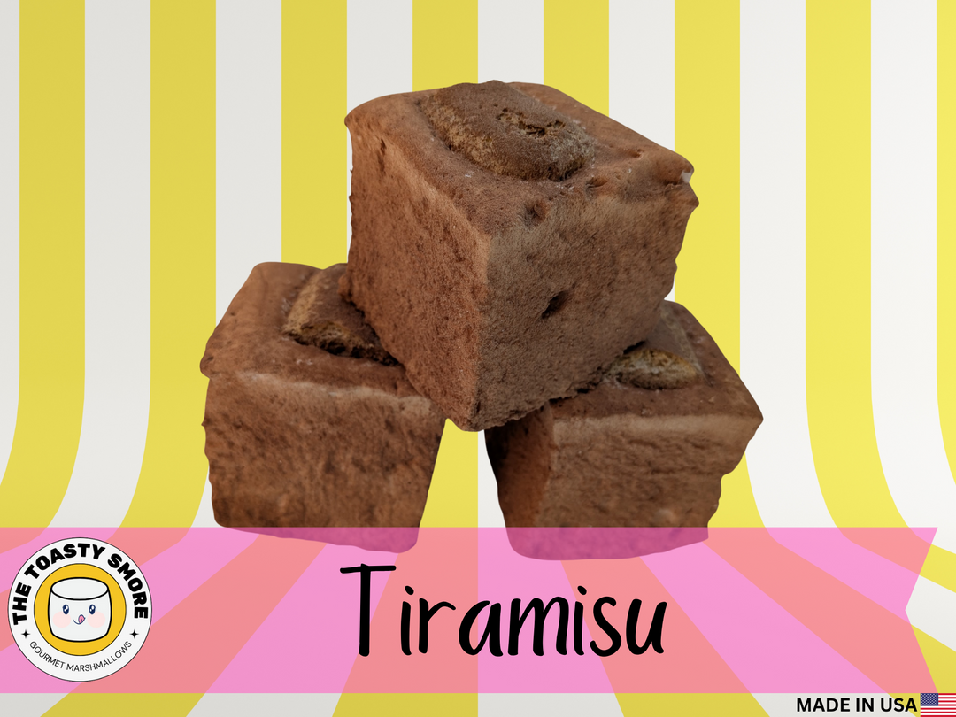Three tiramisu-flavored Tiramisu Gourmet Marshmallows stacked on a striped background with 'The Toasty Snob' branding.