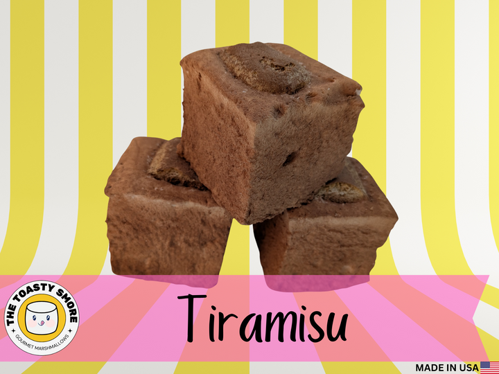Three tiramisu-flavored Tiramisu Gourmet Marshmallows stacked on a striped background with 'The Toasty Snob' branding.