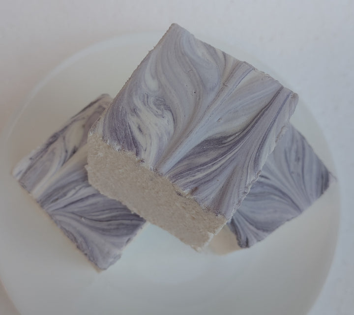 Top view of three Creamy Taro marshmallows with white bases and purple swirled tops, photographed on a bright white background, made in the USA with Halal‑certified beef gelatin, organic marshmallow root, natural dyes, no corn syrup, and gluten‑free ingredients from The Toasty S’more.