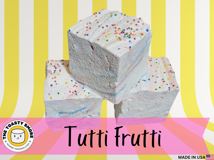 Tutti Frutti marshmallows stacked on a plate with pastel swirls and rainbow sprinkles, clean‑label corn‑syrup‑free marshmallows made with beef gelatin and organic marshmallow root.
