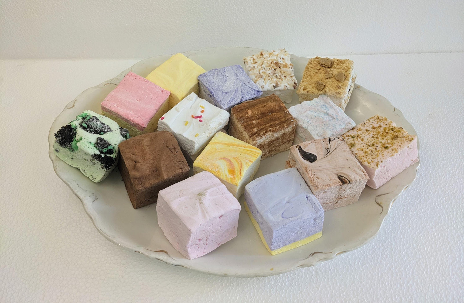 A plate of beautiful colorful marshmallows in various flavors