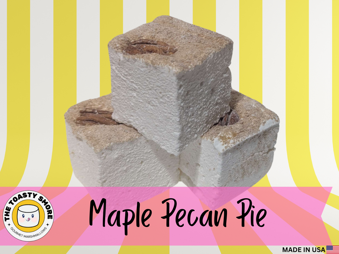 Three maple pecan pie gourmet marshmallows on a striped background with 'The Toasty Smore' logo.