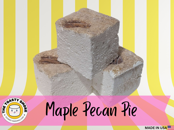 Three maple pecan pie gourmet marshmallows on a striped background with 'The Toasty Smore' logo.