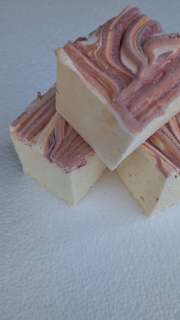 Clean‑label marshmallows in a soft yellow base topped with red and orange fall accents, handcrafted with organic marshmallow root, natural colors, and gluten‑free ingredients.