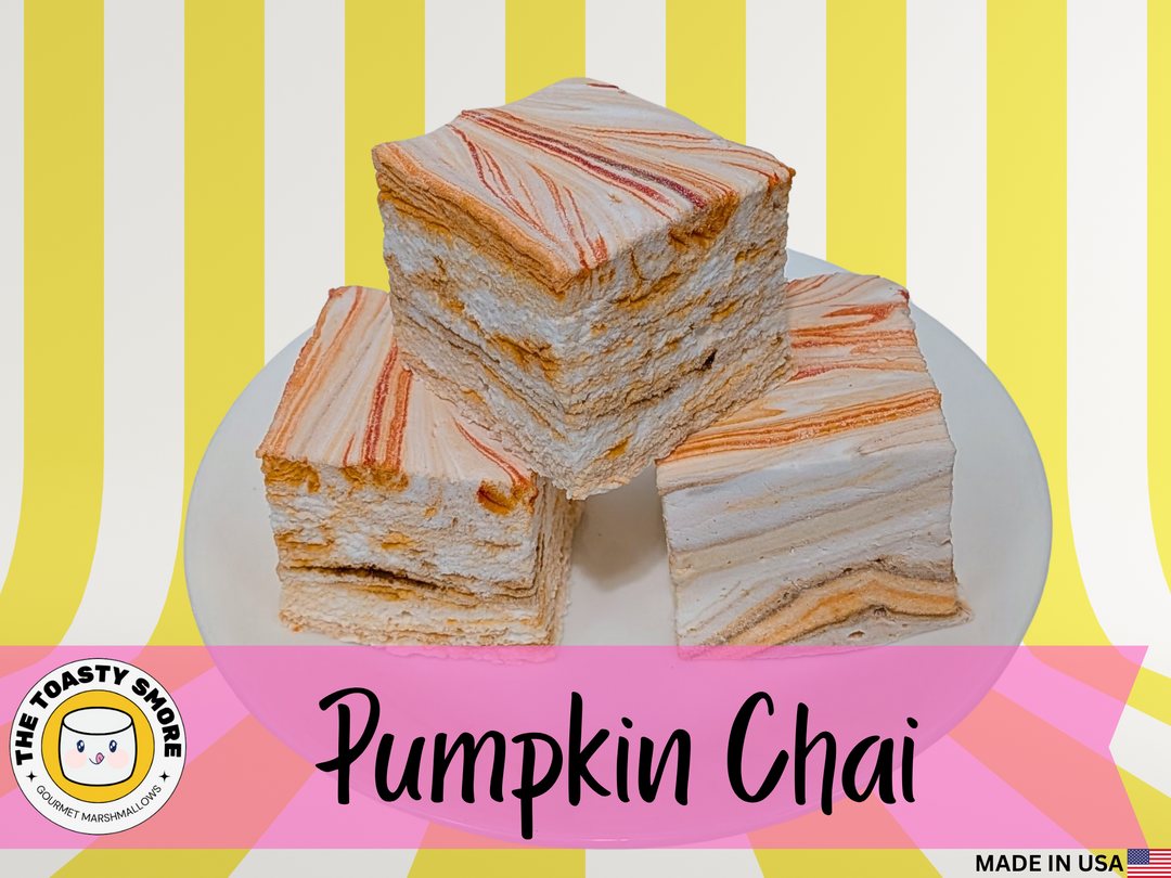 Layered dessert with pumpkin and chai flavors on a colorful striped background, featuring The Toasty Snob brand.
